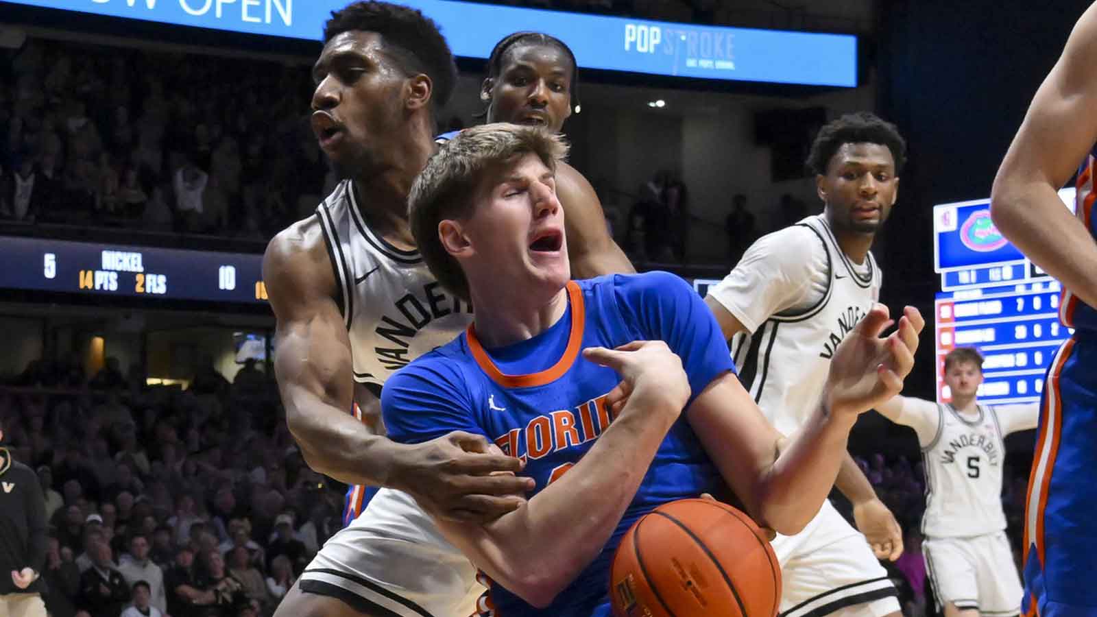 Vanderbilt Commodores forward Ak Okereke (10) fouls Florida Gators forward Alex Condon (21) after a rebound late during the second half at Memorial Gymnasium. 