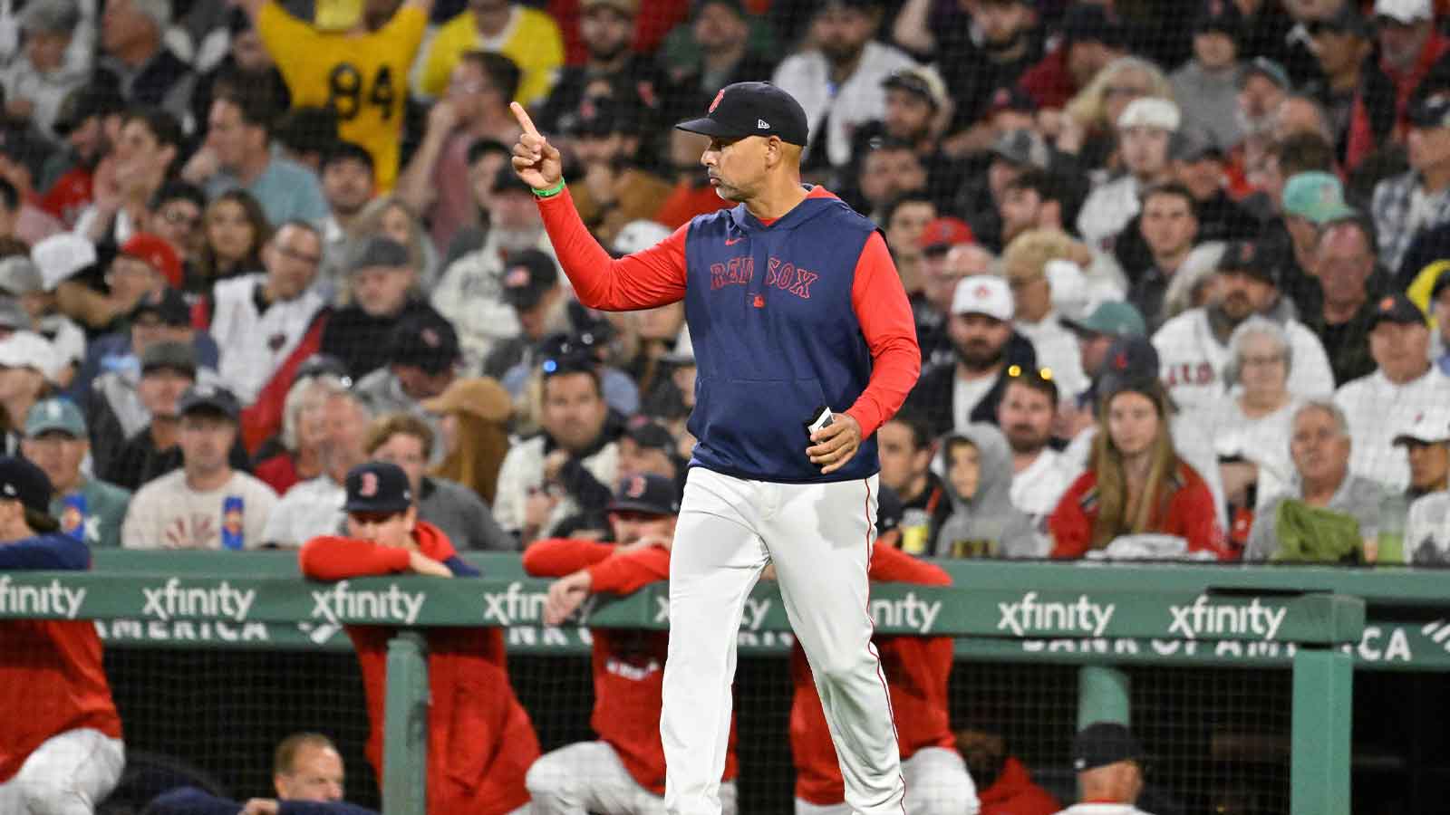Boston Red Sox manager Alex Cora (21) signals to the bullpen during the fifth inning against the Athletics at Fenway Park.