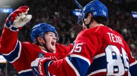 Montreal Canadiens left wing Alexandre Texier (85) celebrates with right wing Cole Caufield (13) his second goal of the game against the Florida Panthers during the third period at Bell Centre.