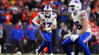 Buffalo Bills quarterback Josh Allen (17) runs during the fourth quarter of an AFC Divisional Round playoff game against the Denver Broncos at Empower Field at Mile High