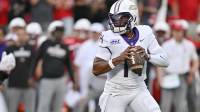 James Madison Dukes quarterback Alonza Barnett III (14) looks to pass against the Louisville Cardinals during the first half at L&N Federal Credit Union Stadium. Louisville defeated James Madison 28-14.