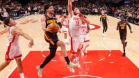 Atlanta Hawks forward Corey Kispert (24) shoots past Houston Rockets center Alperen Sengun (28) in the second half at State Farm Arena.
