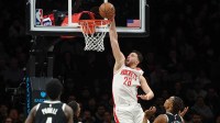 Houston Rockets center Alperen Sengun (28) goes up for a dunk in front of Brooklyn Nets center Nic Claxton (33) during the first half at Barclays Center.