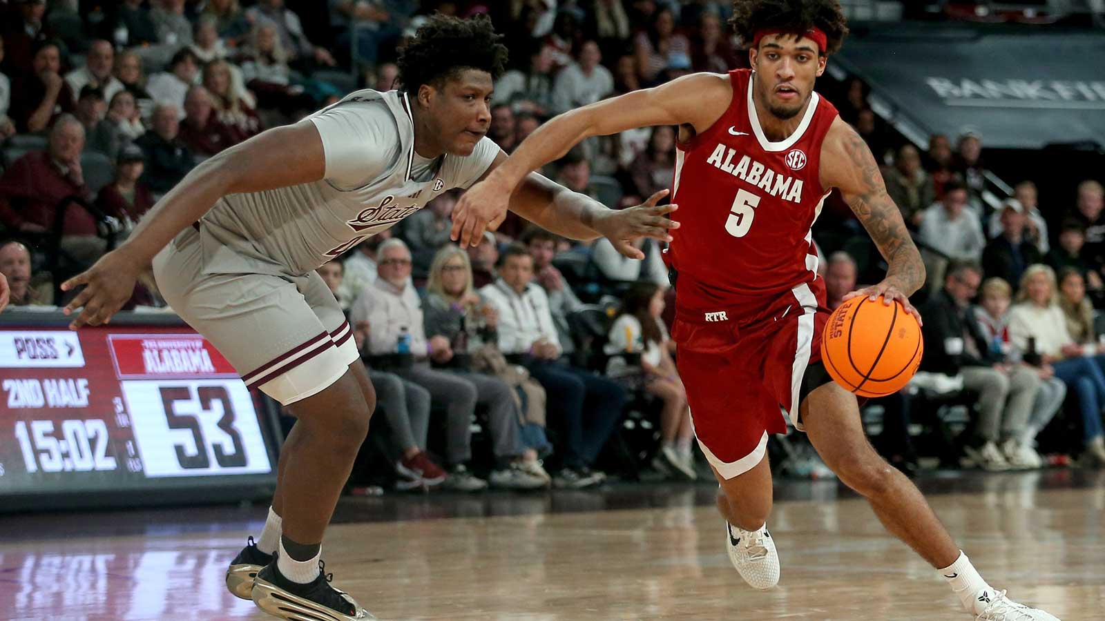 Alabama Crimson Tide forward Amari Allen (5) drives to the basket past Mississippi State Bulldogs forward Brandon Walker (4) during the second half at Humphrey Coliseum.