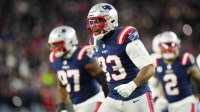 New England Patriots linebacker Anfernee Jennings (33) celebrates a sack during the fourth quarter against the Los Angeles Chargers in an AFC Wild Card Round game at Gillette Stadium.