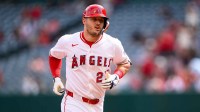 Los Angeles Angels designated hitter Mike Trout (27) runs after hitting a home run during the first inning against the Houston Astros at Angel Stadium.
