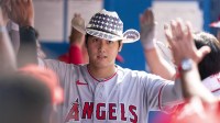 Los Angeles Angels designated hitter Shohei Ohtani (17) celebrates in the dugout after hitting a two-run home run against the Toronto Blue Jays during the seventh inning at Rogers Centre.