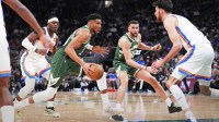 Milwaukee Bucks forward Giannis Antetokounmpo (34) drives to the basket against Oklahoma City Thunder center/forward Chet Holmgren (7) in the first half at Fiserv Forum