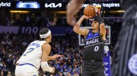 Orlando Magic guard Anthony Black (0) shoots a three point basket against Indiana Pacers guard Andrew Nembhard (2) during the first quarter at Kia Center.