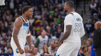 Minnesota Timberwolves guard Anthony Edwards (5) and forward Julius Randle (30) celebrate against the Sacramento Kings in the fourth quarter at Target Center.