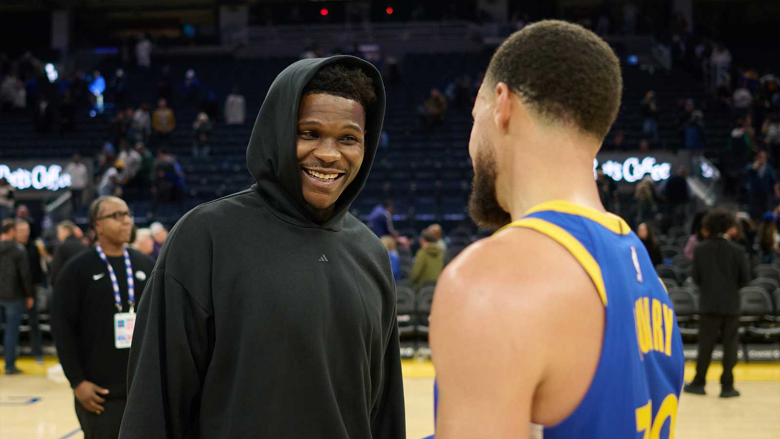 Minnesota Timberwolves guard Anthony Edwards (5) chats with Golden State Warriors guard Stephen Curry (30) at center court after the game at Chase Center.
