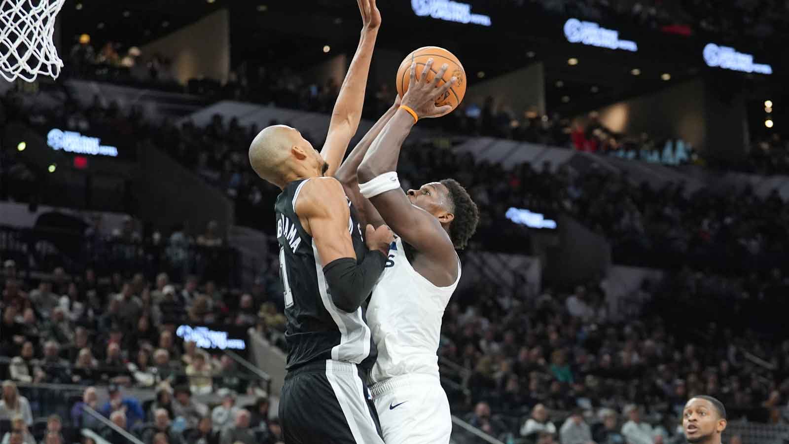 Minnesota Timberwolves guard Anthony Edwards (5) shoots against San Antonio Spurs forward Victor Wembanyama (1) in the first half at Frost Bank Center.