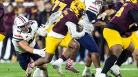 Arizona State Sun Devils running back Raleek Brown (3) runs the ball against Arizona Wildcats defensive lineman Mays Pese (99) in the first half during the 99th Territorial Cup at Mountain America Stadium.