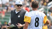 Pittsburgh Steelers offensive coordinator Arthur Smith talks with quarterback Aaron Rodgers (8) during drills at training camp at Saint Vincent College.