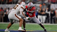 Miami Hurricanes offensive lineman Francis Mauigoa (61) blocks Ohio State Buckeyes linebacker Arvell Reese (8) during the 2025 Cotton Bowl and quarterfinal game of the College Football Playoff at AT&T Stadium.