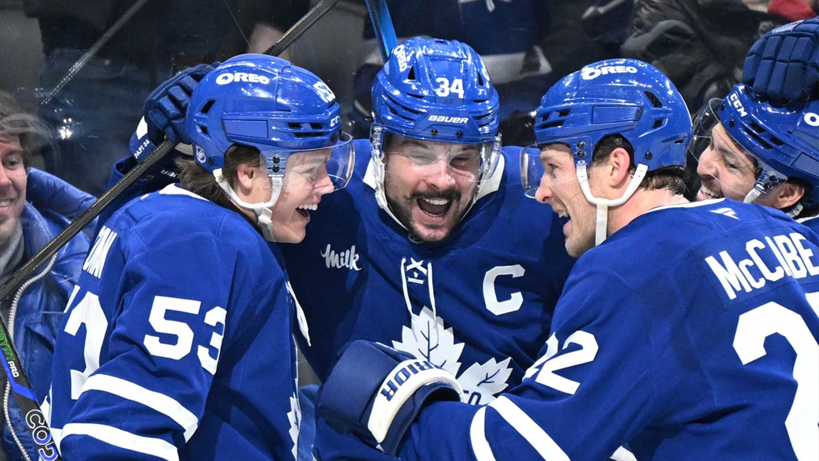 Toronto Maple Leafs forward Auston Matthews (34) celebrates with forwards Easton Cowan (53) and Nick Robertson (89) and defensemen Jake McCabe (22) and Troy Stecher (28) after scoring his third goal of the game against the Winnipeg Jets in the third period at Scotiabank Arena.