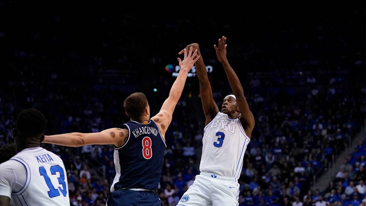 BYU Cougars forward AJ Dybantsa (3) shoots the ball while being defended by Arizona Wildcats forward Ivan Kharchenkov (8) during the first half at Marriott Center.