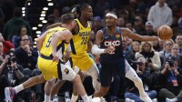Oklahoma City Thunder guard Shai Gilgeous-Alexander (2) moves the ball around Indiana Pacers guard/forward Aaron Nesmith (23) during the second half at Paycom Center. Mandatory Credit: Alonzo Adams-Imagn Images