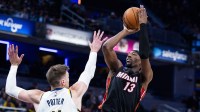 Miami Heat center/forward Bam Adebayo (13) shoots the ball while Indiana Pacers center Micah Potter (11) defends in the second half at Gainbridge Fieldhouse.