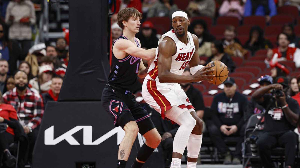 Chicago Bulls forward Matas Buzelis (14) defends against Miami Heat center Bam Adebayo (13) during the first half at United Center.