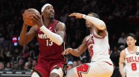 Miami Heat center Bam Adebayo (13) goes up for a shot as Chicago Bulls forward Isaac Okoro (35) defends during the second half at Kaseya Center.