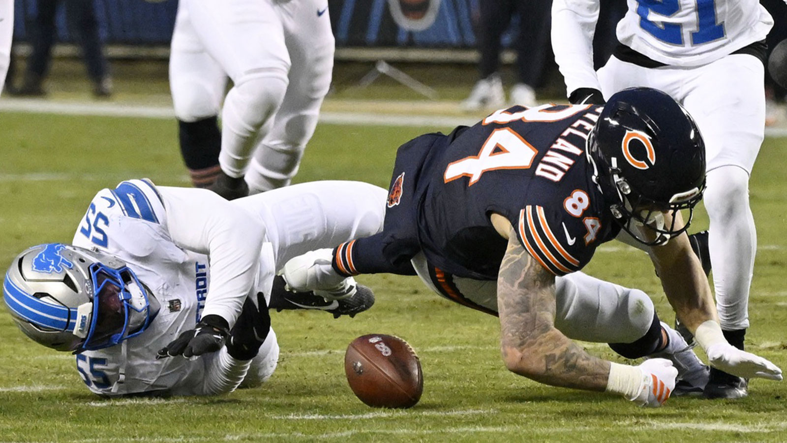Chicago Bears tight end Colston Loveland (84) fumbles the ball for a turnover against Detroit Lions linebacker Derrick Barnes (55) during the first half at Soldier Field.