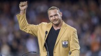 Chicago Bears former player Brian Urlacher is honored during halftime of a game between the Chicago Bears and the Seattle Seahawks at Soldier Field.