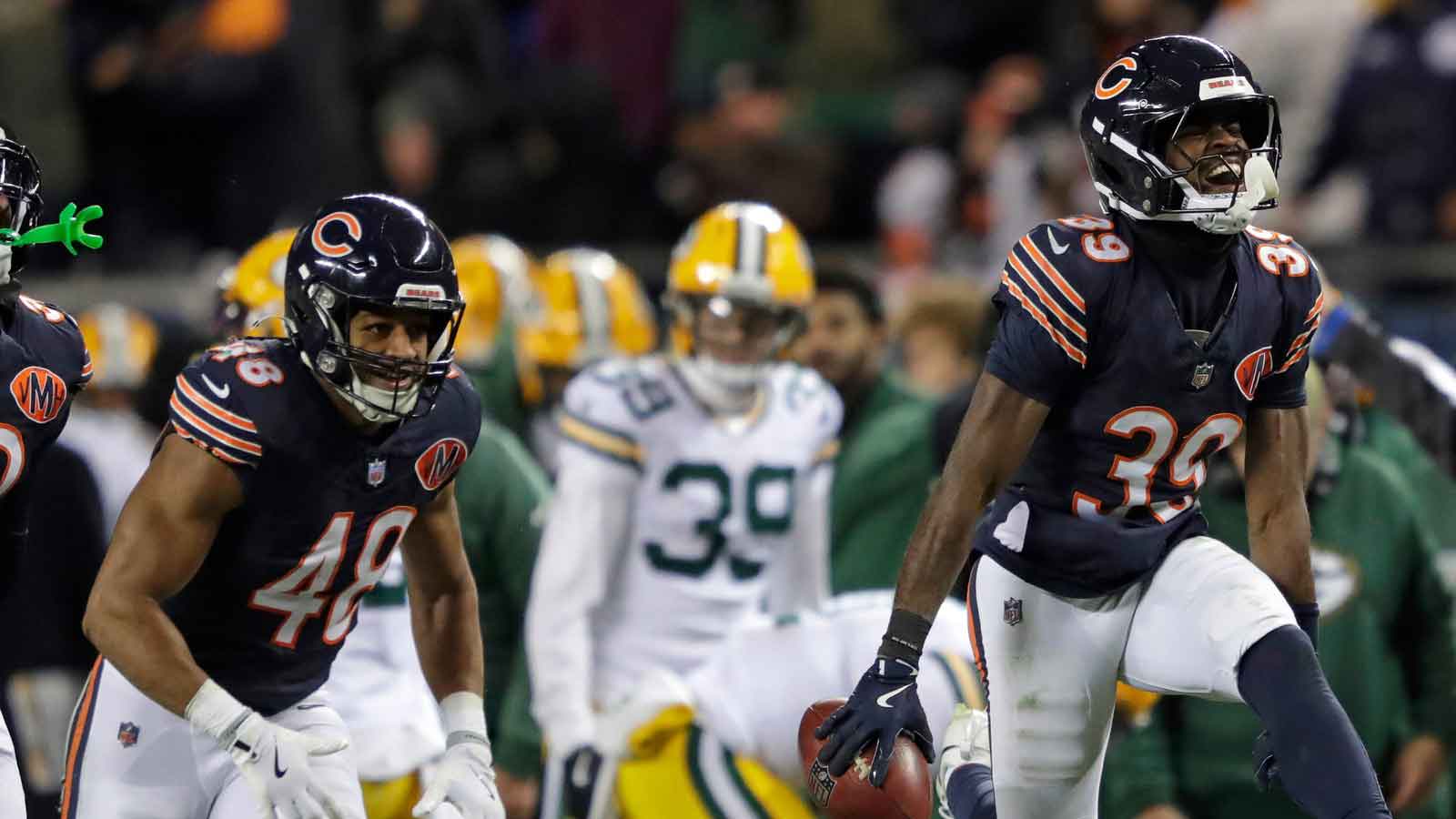 Chicago Bears cornerback Josh Blackwell (39) celebrates recovering an onside kick mishandled by Green Bay Packers wide receiver Romeo Doubs (87) in the fourth quarte