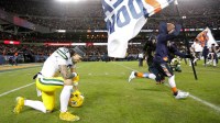Green Bay Packers wide receiver Christian Watson (9) takes a knee after losing to the Chicago Bears during their wild-card playoff football game Saturday, January 10, 2026, at Soldier Field in Chicago, Illinois.