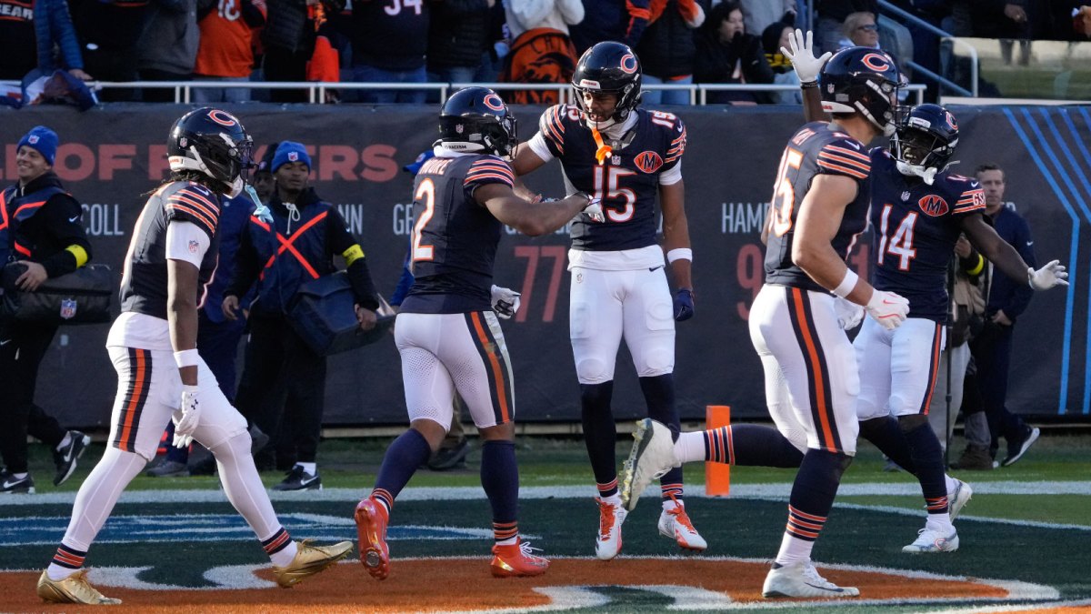 Chicago Bears wide receiver DJ Moore (2) reacts with wide receiver Rome Odunze (15) after catching a touchdown against the Pittsburgh Steelers during the second half at Soldier Field.