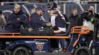 Chicago Bears linebacker T.J. Edwards (53) is carted off the field after being injured during the second quarter of their wild card playoff game against the Green Bay Packers Saturday, January 10, 2026 at Soldier Field in Chicago, Illinois.