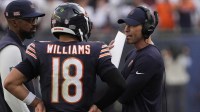 Chicago Bears head coach Ben Johnson talks with quarterback Caleb Williams (18) against the Dallas Cowboys during the second half at Soldier Field.