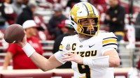 Missouri Tigers quarterback Beau Pribula (9) warms up before the game against the Oklahoma Sooners at Gaylord Family-Oklahoma Memorial Stadium.