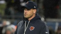 Chicago Bears head coach Ben Johnson looks on during warmups before an NFC Divisional Round game against the Los Angeles Rams at Soldier Field.