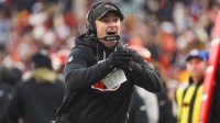 Cincinnati Bengals head coach Zac Taylor signals for a timeout during the fourth quarter against the Cleveland Browns at Paycor Stadium.