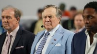 TV analyst Bill Belichick watches the Miami Hurricanes play the Indiana Hoosiers during the first half of the College Football Playoff National Championship game at Hard Rock Stadium.
