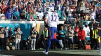 Buffalo Bills quarterback Josh Allen (17) scores a touchdown during the second half against the Jacksonville Jaguars in an AFC Wild Card Round game at EverBank Stadium.