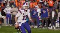 Buffalo Bills quarterback Josh Allen keeps the ball and gets about five yards on the play during first half action at Empower FIeld at Mile High in Denver, Colorado on Jan. 17, 2026.
