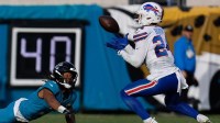 Jacksonville Jaguars wide receiver Jakobi Meyers (3) can only watch as Buffalo Bills safety Cole Bishop (24) intercepts the ball on the last play of the game in an NFL football AFC Wild Card playoff matchup, Sunday, Jan. 11, 2026, in Jacksonville, Fla. Bills lead 10-7 at the half over the Jaguars. The Bills defeated the Jaguars 27-24.