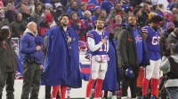 Buffalo Bills head coach Sean McDermott, quarterback Josh Allen, quarterback Mitchell Trubisky, and left tackle Dion Dawkins listen to the singing of the National Anthem before first half action against the Jets at home in Highmark Stadium in Orchard Park on Jan. 4, 2026.