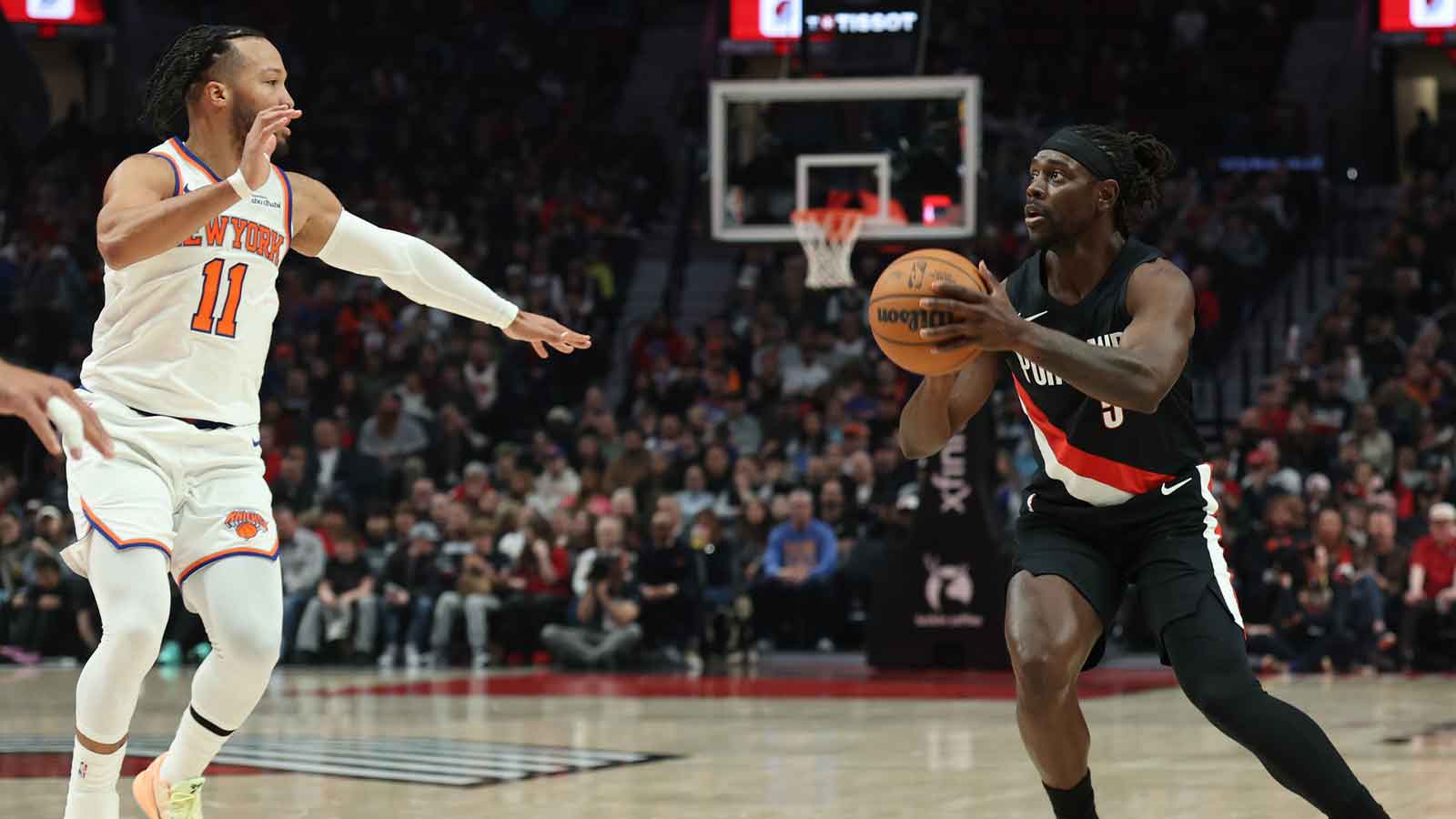 Blazers guard Jrue Holiday (5) shoots the ball against New York Knicks guard Jalen Brunson (11) during the first half at Moda Center