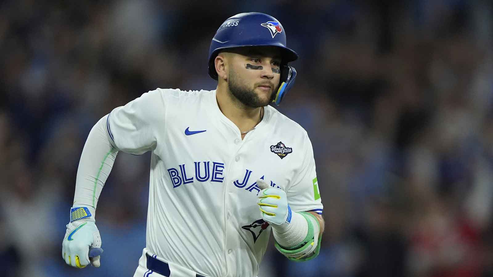 Toronto Blue Jays designated hitter Bo Bichette (11) runs after hitting a three run home run against the Los Angeles Dodgers in the third inning during game seven of the 2025 MLB World Series at Rogers Centre.