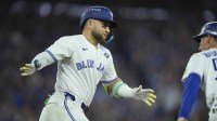 Toronto Blue Jays designated hitter Bo Bichette (11) reacts as he runs the bases after hitting a three run home run against the Los Angeles Dodgers in the third inning during game seven of the 2025 MLB World Series at Rogers Centre.