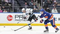 Utah Mammoth center Nick Schmaltz (8) attempts a shot on goal past New York Islanders center Bo Horvat (14) in the first period at UBS Arena.