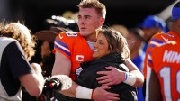 Denver Broncos quarterback Bo Nix (10) hugs wife, Izzy Nix before the game against the Los Angeles Chargers at Empower Field at Mile High.