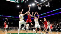 Jan 5, 2026; Boston, Massachusetts, USA; Chicago Bulls forward Matas Buzelis (14) shoots the ball while Boston Celtics forward Sam Hauser (30) and center Luka Garza (52) defend during the second half at TD Garden. Mandatory Credit: Bob DeChiara-Imagn Images