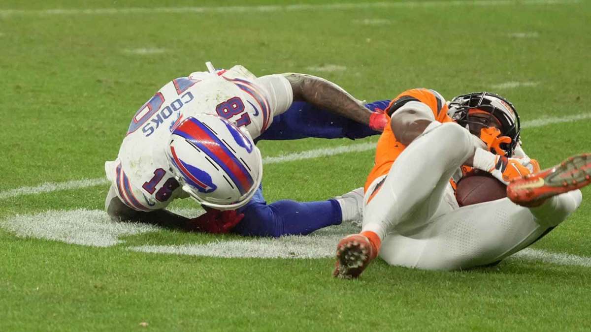 Denver Broncos cornerback Ja'quan McMillian rips the ball out of Buffalo Bills wide receiver Brandin Cooks’ arms and the ruling was it was Denver’s ball during overtime at Empower FIeld at Mile High in Denver, Colorado on Jan. 17, 2026.