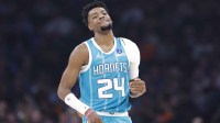 Charlotte Hornets forward Brandon Miller (24) smiles as he walks down the court after a play against the Oklahoma City Thunder during the second quarter at Paycom Center.