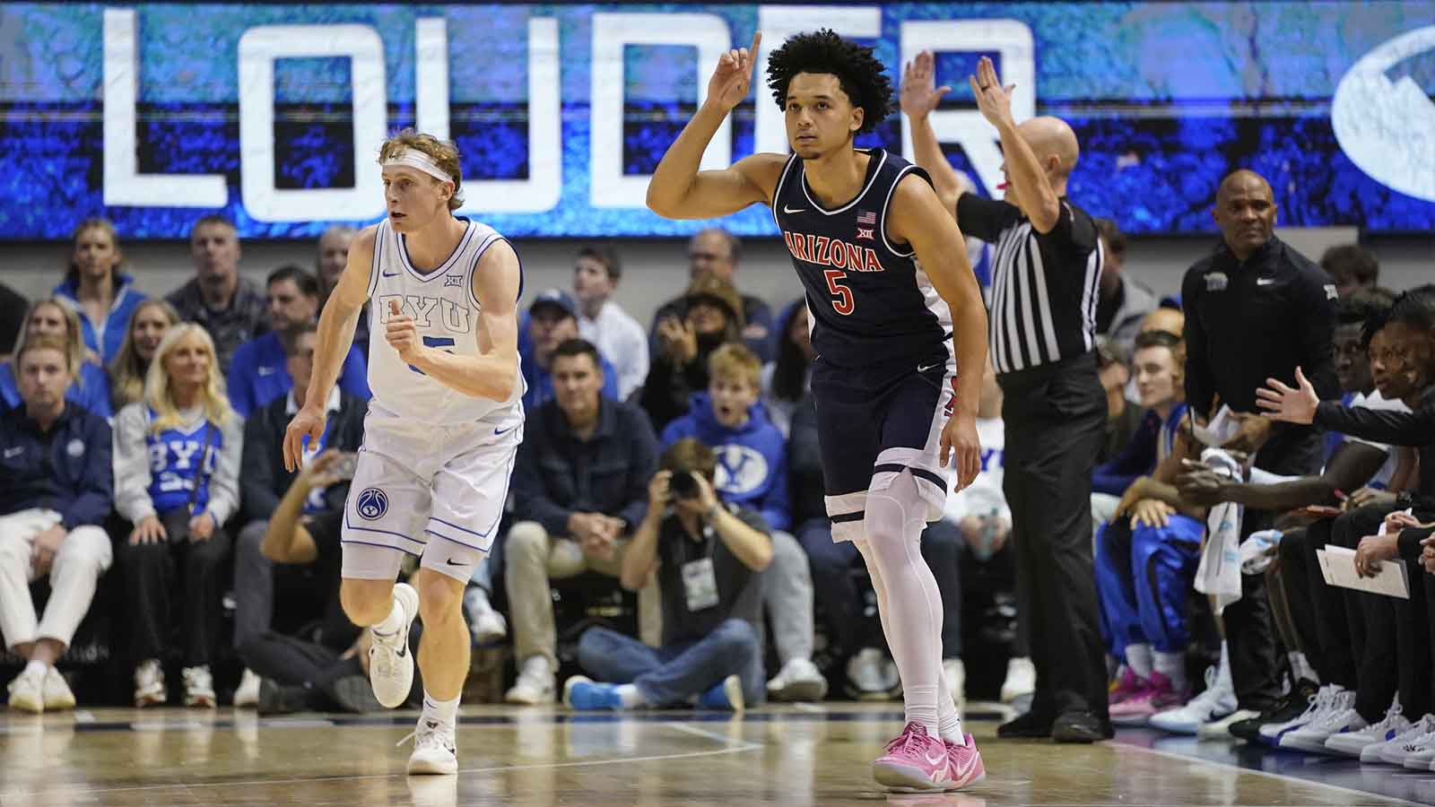 Arizona Wildcats guard Brayden Burries (5) reacts to a three-pointer during the first half against the BYU Cougars at Marriott Center.