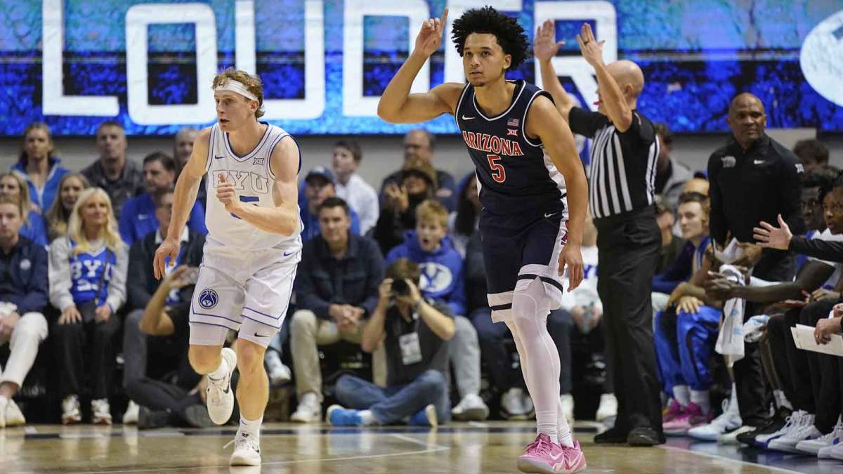 Arizona Wildcats guard Brayden Burries (5) reacts to a three-pointer during the first half against the BYU Cougars at Marriott Center.